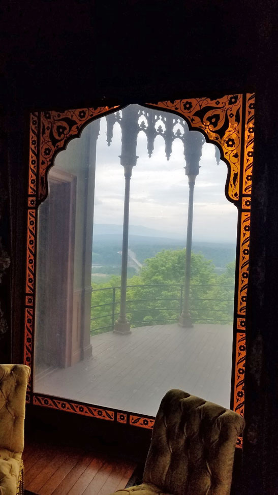 Studio window looking out to curved balcony at Olana